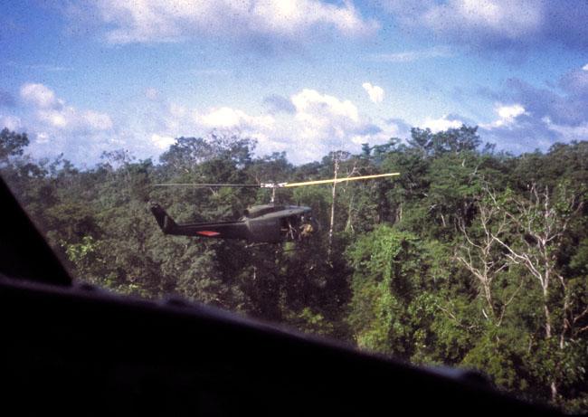 A SAS trooper climbs aboard a helicopter A SAS trooper climbs aboard a helicopter