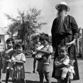 Father Olivier and children at Binh Loi Orphanage