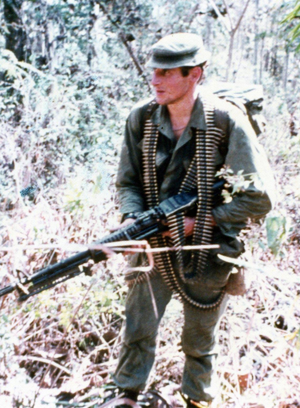 Alan Sherris carrying M60 machine gun