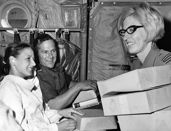 Claire Jacobson hands out lunch to Major P.G. Hotop and his wife