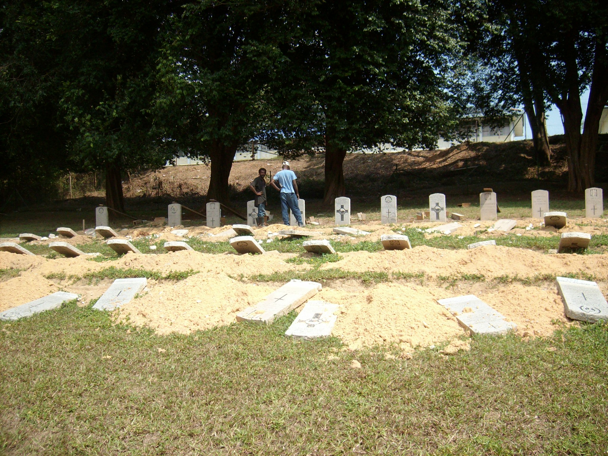Maintenance being carried out at Terendak Military Cemetery, Malaysia