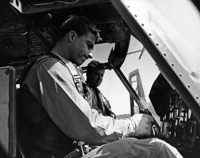 F/O Butler and F/O Creelman carry out final pre-flight checks in the cockpit of a Iroquois helicopter