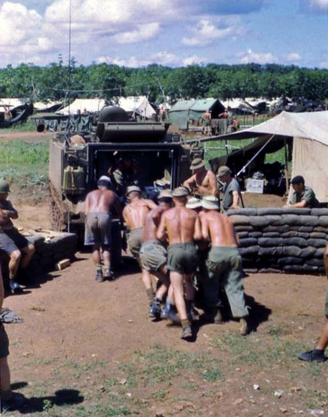 Loading gun into APC, 1966