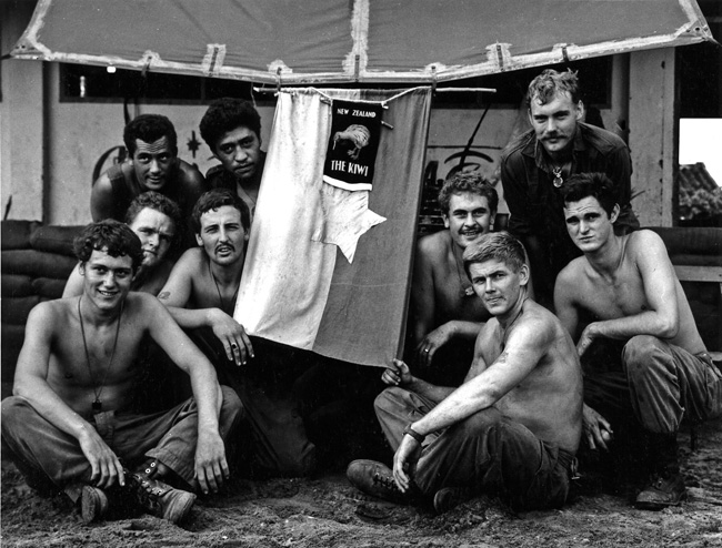 New Zealand soldiers with a souvenired North Vietnamese flag, circa 1969