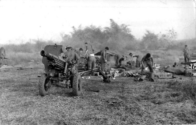 161 Battery gunners clean up after fire mission, 1967