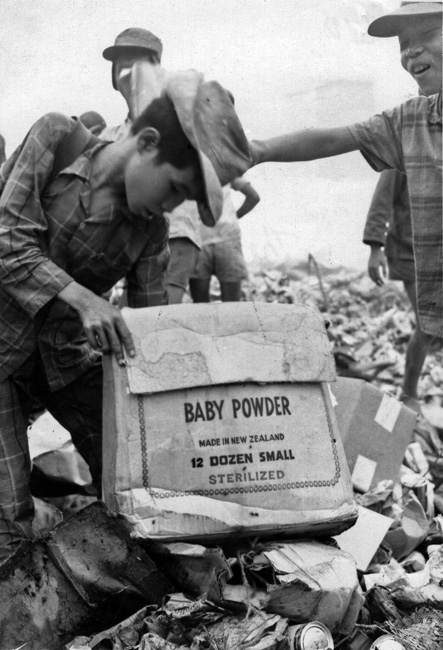 Children scavenging in rubbish dump, circa 1969