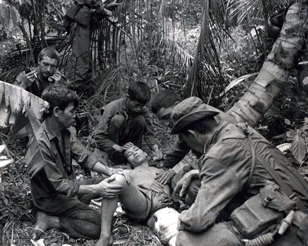 Corporal TG Gordon treats a wounded VC after a contact, circa 1969