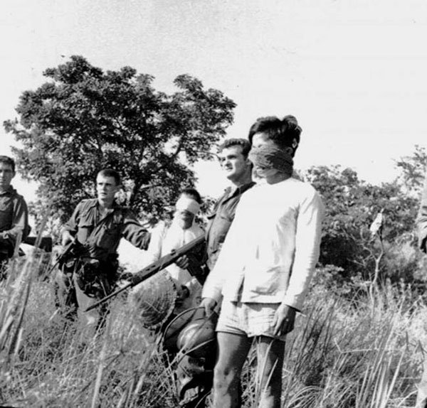 Australian soldiers escort Viet Cong prisoners, 1966