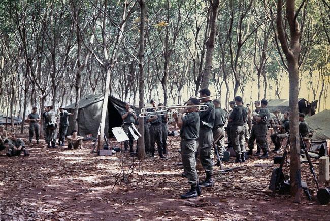 The band plays amongst the rubber trees at FSB Discovery - 1RNZIR Band Tour, 1969 The band plays amongst the rubber trees at FSB Discovery - 1RNZIR Band Tour, 1969
