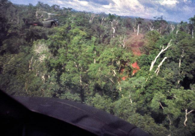 A SAS patrol pops red smoke to guide helicopters to their location A SAS patrol pops red smoke to guide helicopters to their location