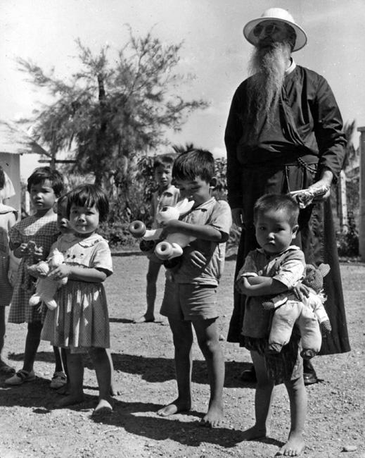 Father Olivier and children at Binh Loi Orphanage Father Olivier and children at Binh Loi Orphanage