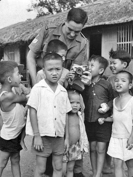 SSgt Graham (Dick) Grigg with Vietnamese orphans SSgt Graham (Dick) Grigg with Vietnamese orphans
