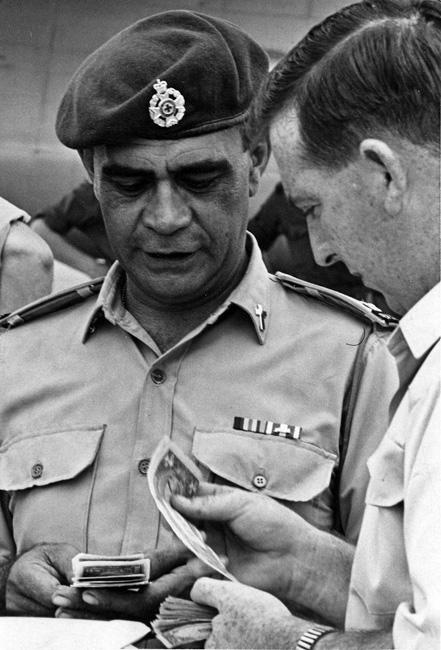 Padre Whakahuihui Vercoe changing money on his last day in South Vietnam Padre Whakahuihui Vercoe changing money on his last day in South Vietnam