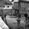 Ken Treanor receives haircut in Montagnard village, circa 1968