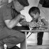 Ken Treanor with Vietnamese orphan in Qui Nhon, 1968