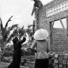 A nun lends a hand during the construction of a new classroom at Binh Loi orphanage, circa 1969