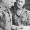 Sergeant's P. Quinn and J. W. Carter discuss troop newspaper, 5 May 1964