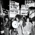 Black and white photograph of Ngā Tamatoa and Polynesian Panthers members marching with signs during an anti-war 'mobilisation' in Auckland, 14 July 1972 