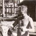 RW Urwin (left) getting his hair cut, circa 1968-1969